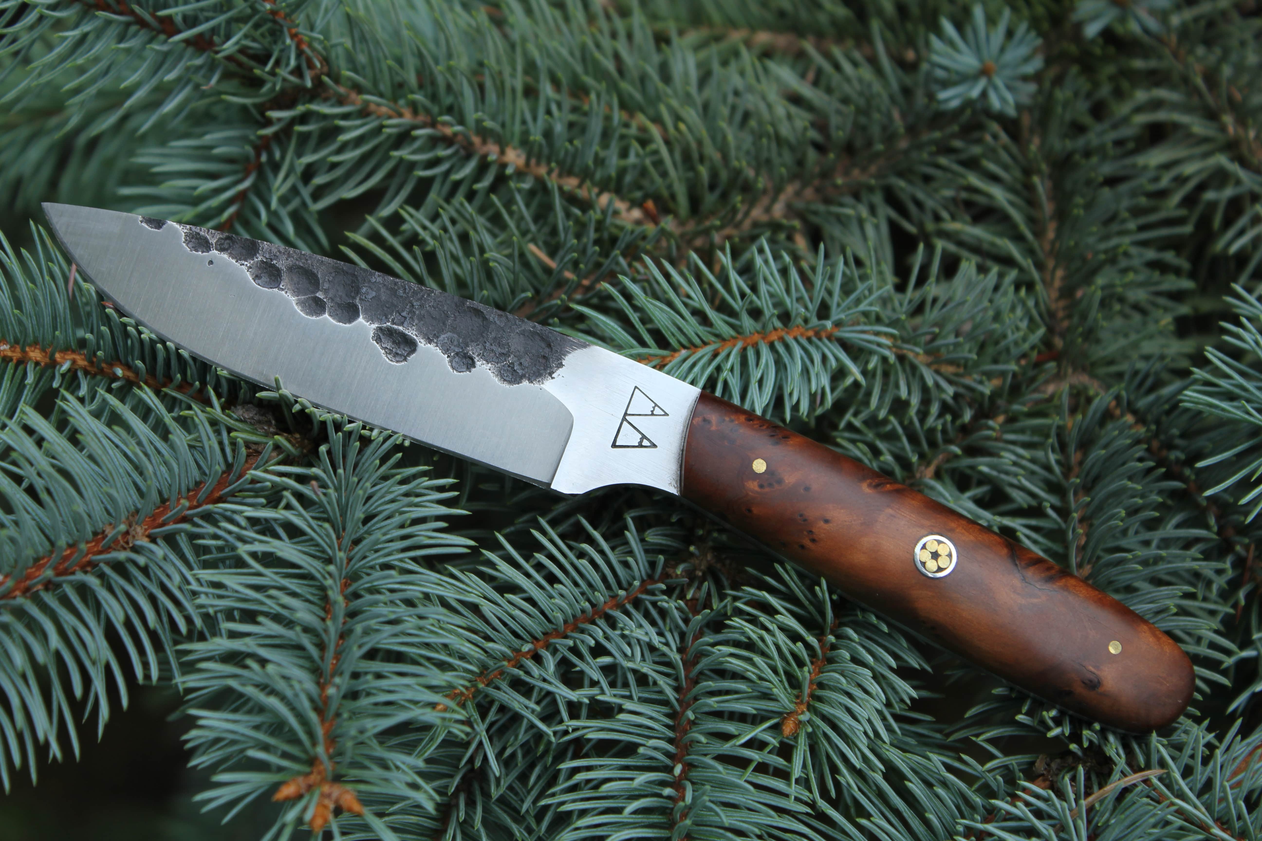 An Impala with a Thuya Burl handle and mosaic pin.